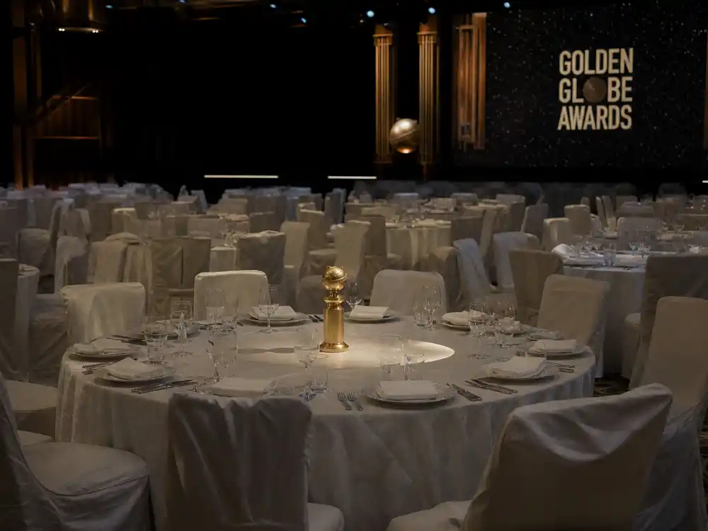 Dimmed Beverly Hilton ballroom with lone Golden Globe trophy marks 2022 NBC hiatus in Golden Globes biggest controversies history
