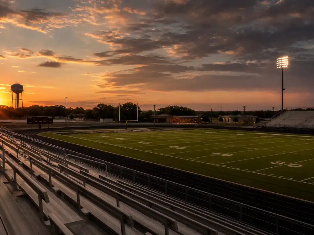 Texas high school football field at dusk represents heartfelt dramas on lists of great TV shows that never won an Emmy