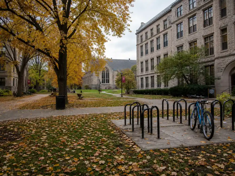 A quiet college campus quad reflecting the years Haley Joel Osment stepped back from peak Hollywood fame