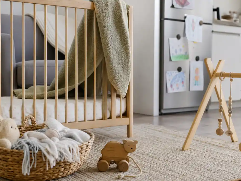 Cozy nursery with wooden toys representing Hilary Duff motherhood and family life in 2026