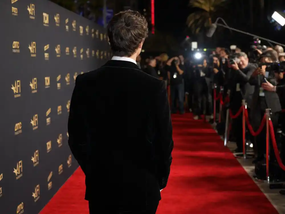 Hollywood red carpet back view for Hollywood nepo babies youngest generation Gen Z debut premiere editorial without identifiable faces