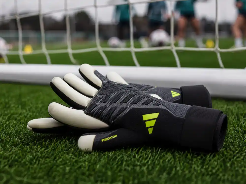 Professional goalkeeper gloves on turf for Hope Solo USWNT shot-stopping legacy