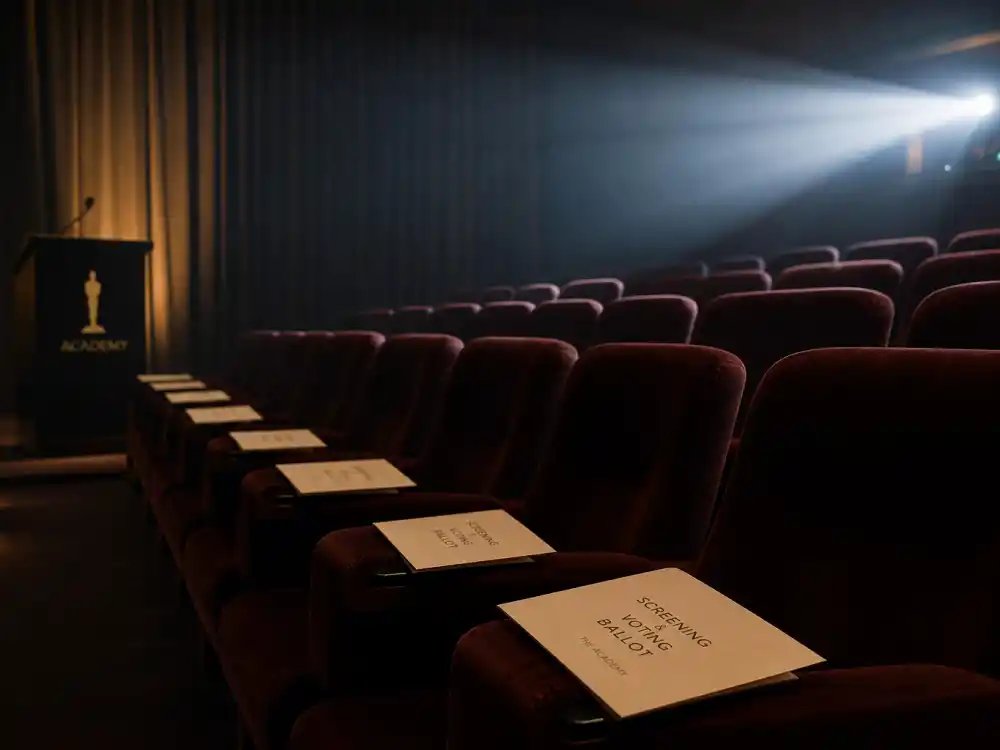 Academy screening room where members watch eligible films before how are Oscar winners chosen voting explained nomination rounds begin