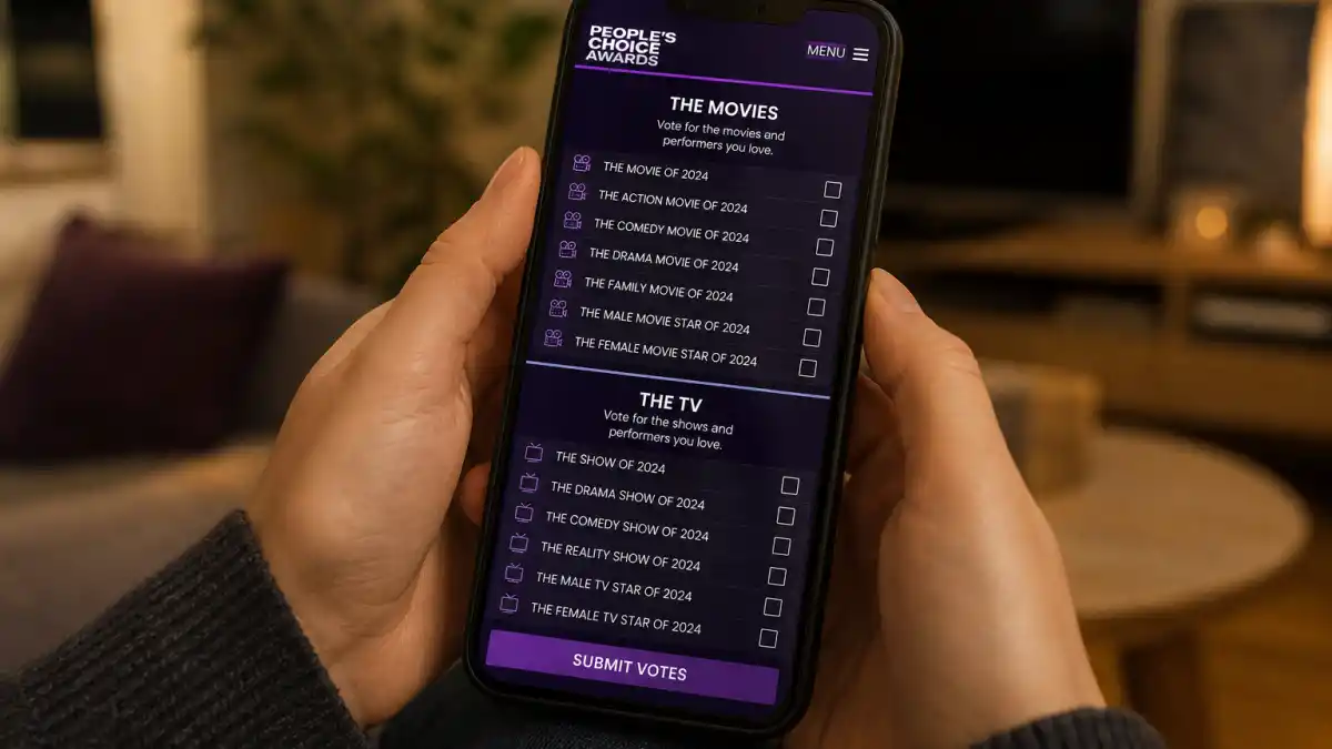 How are Peoples Choice Awards winners chosen — anonymous fan hands holding smartphone with official PCA online voting ballot on screen