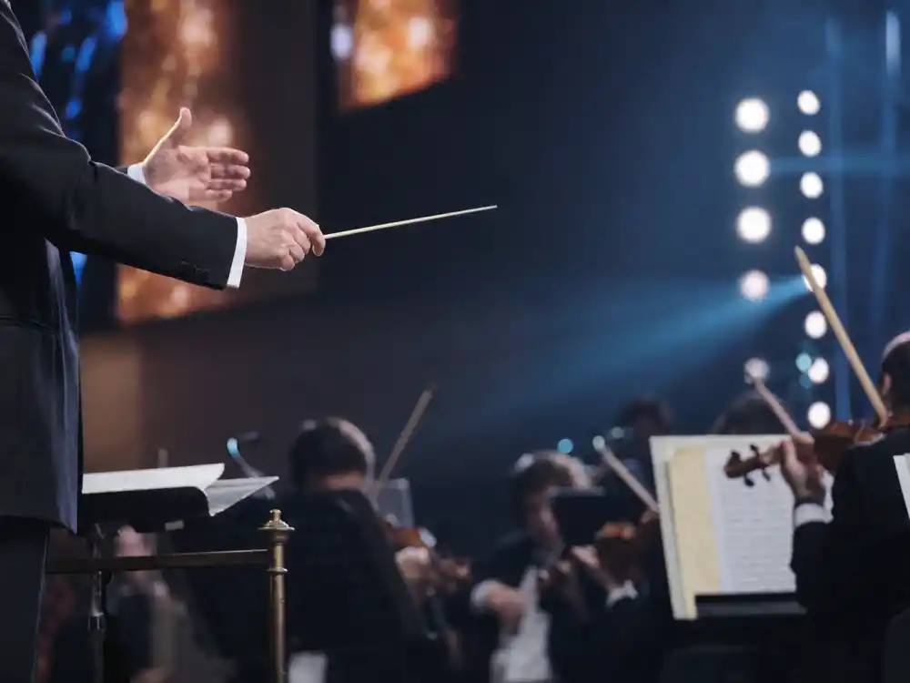 Orchestra musical performance on stage that adds minutes to how long is the Oscars ceremony every broadcast year