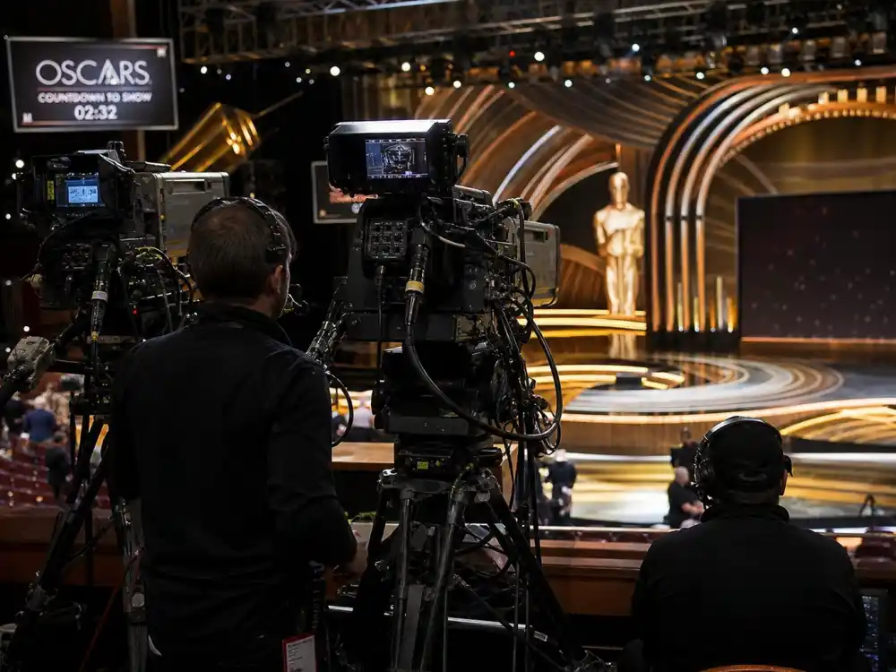 Television broadcast cameras aimed at empty awards stage for how much do the Oscars cost to produce ABC live telecast production spending