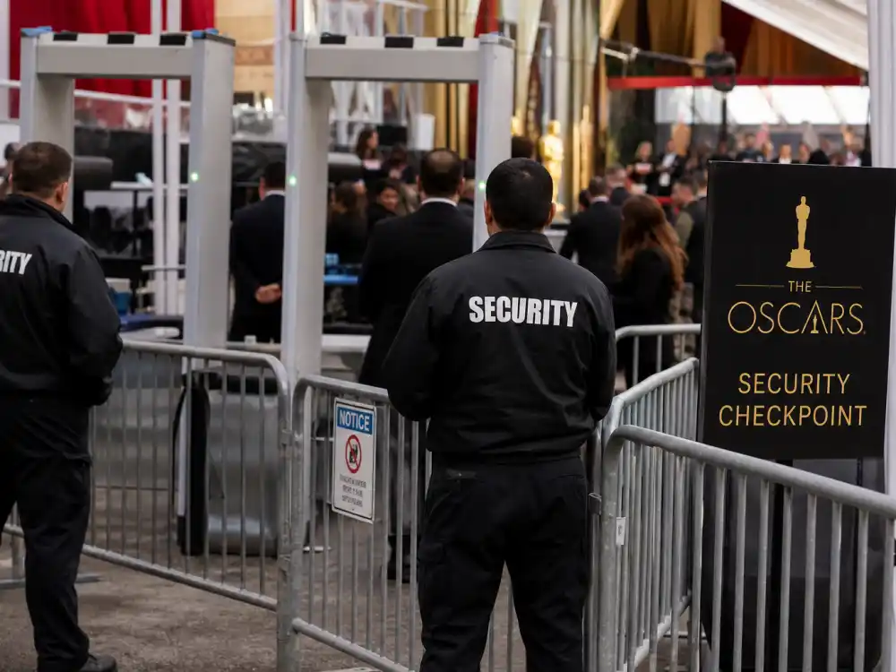 Security checkpoint and barricades at awards venue entrance for how much do the Oscars cost to produce crowd control and protection spending