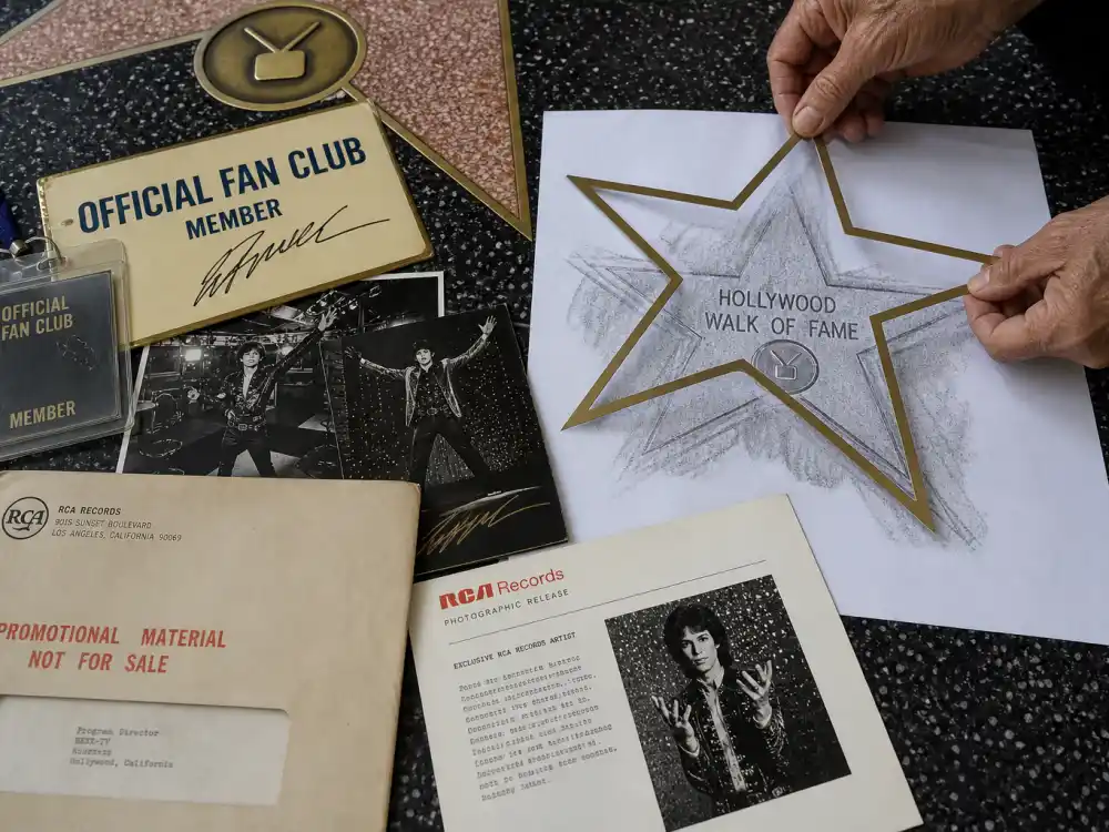Fan club and record label sponsorship materials near a Walk of Fame star rubbing — who pays how much does a Walk of Fame star cost