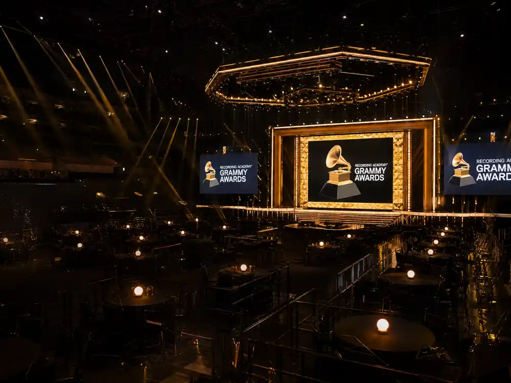 Grammy-style arena with floor tables facing a music awards stage — how much does it cost to attend award shows at the Recording Academy telecast