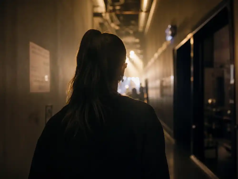 High ponytail silhouette from behind reflecting Ariana Grande age and signature style across her pop music career milestones