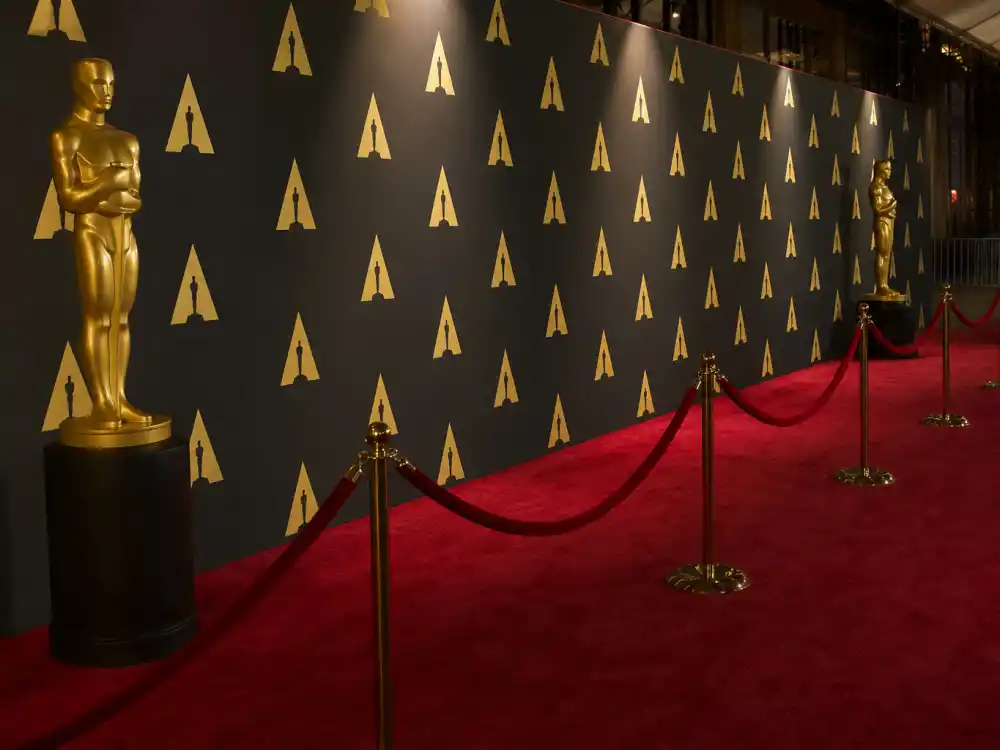 Red carpet premiere display reflecting how old is Awkwafina at industry peak — Golden Globe milestones and blockbuster franchise dominance in her late thirties