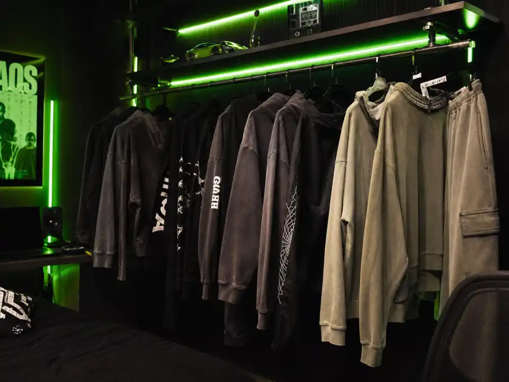Oversized streetwear on a clothing rack reflecting Billie Eilish age and fashion era milestones across her public career