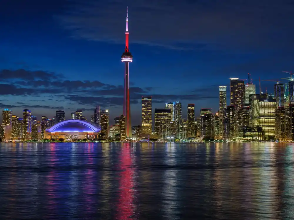 Toronto skyline at night for how old is Drake birthplace editorial without identifiable faces