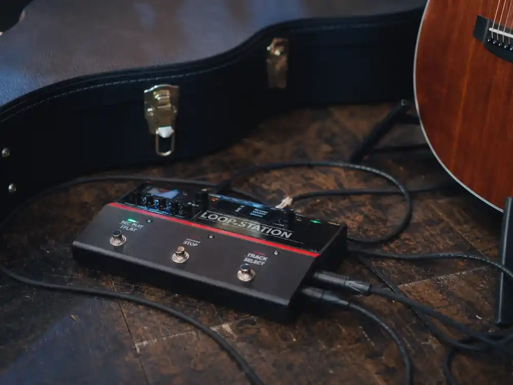 Loop pedal and guitar cables on stage reflecting how old is Ed Sheeran signature one-man live show style from teenage busking through arena world tours