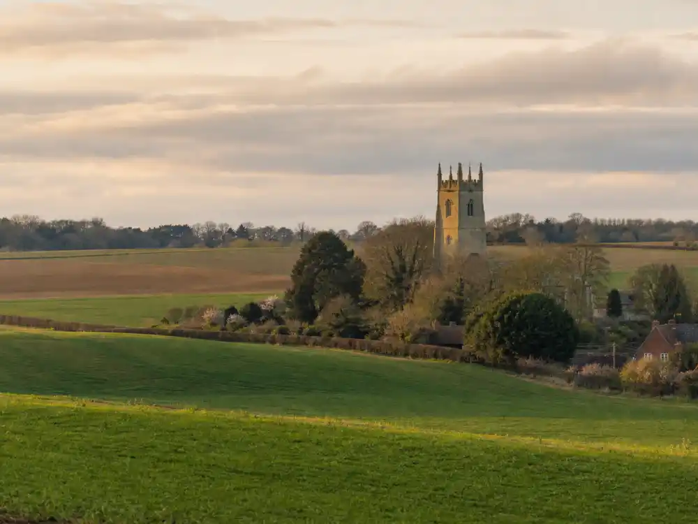 Suffolk England countryside evoking how old is Ed Sheeran upbringing — the rural county where he grew up in Framlingham after his Yorkshire birth