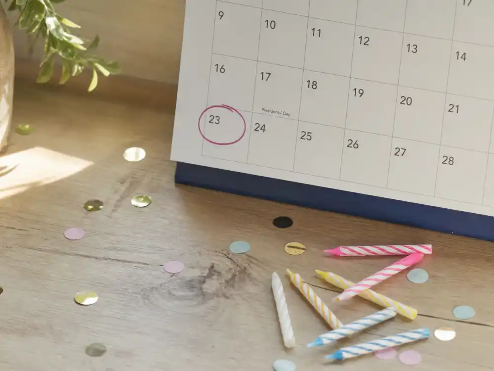February 23 birthday calendar and candles marking how old is Emily Blunt each year when fans celebrate her Pisces birth date