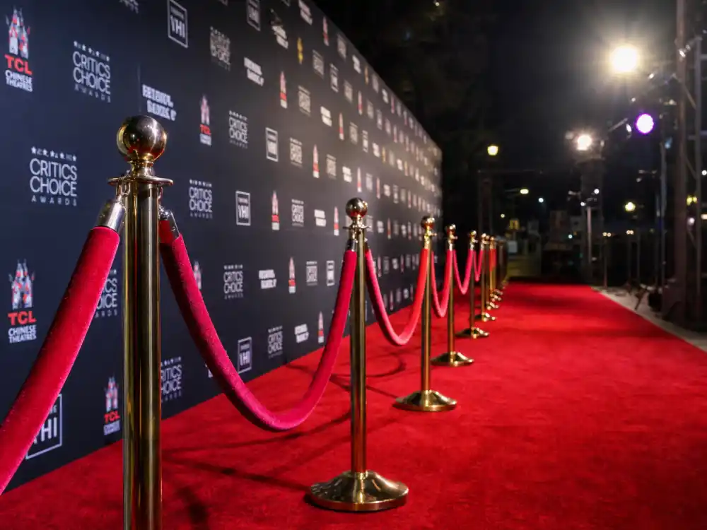 Red carpet premiere display reflecting how old is Gal Gadot at industry peak — blockbuster milestones and Wonder Woman franchise dominance across two decades