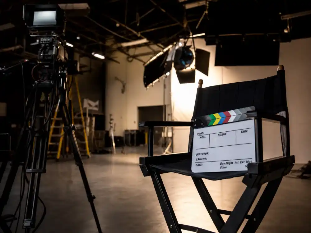 Film studio set reflecting how old is George Clooney career arc from 1980s television roles to Oscar-winning blockbuster dominance and directing across four decades