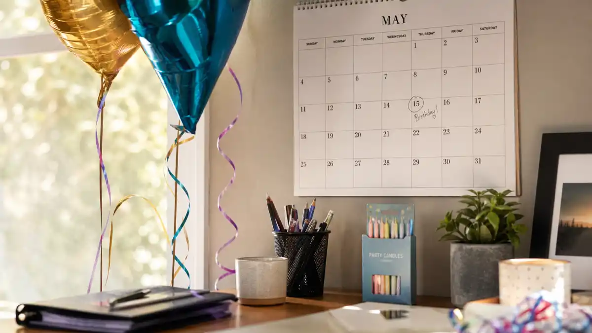 How old is Henry Cavill — desk calendar open to May with birthday decorations marking his Taurus birth date