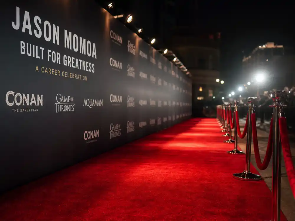Red carpet premiere display reflecting how old is Jason Momoa at industry peak — blockbuster franchise milestones and action-film dominance in his forties