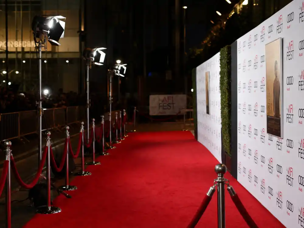 Red carpet premiere display reflecting how old is Jennifer Lawrence at industry peak — Oscar milestones and Hunger Games franchise dominance across two decades