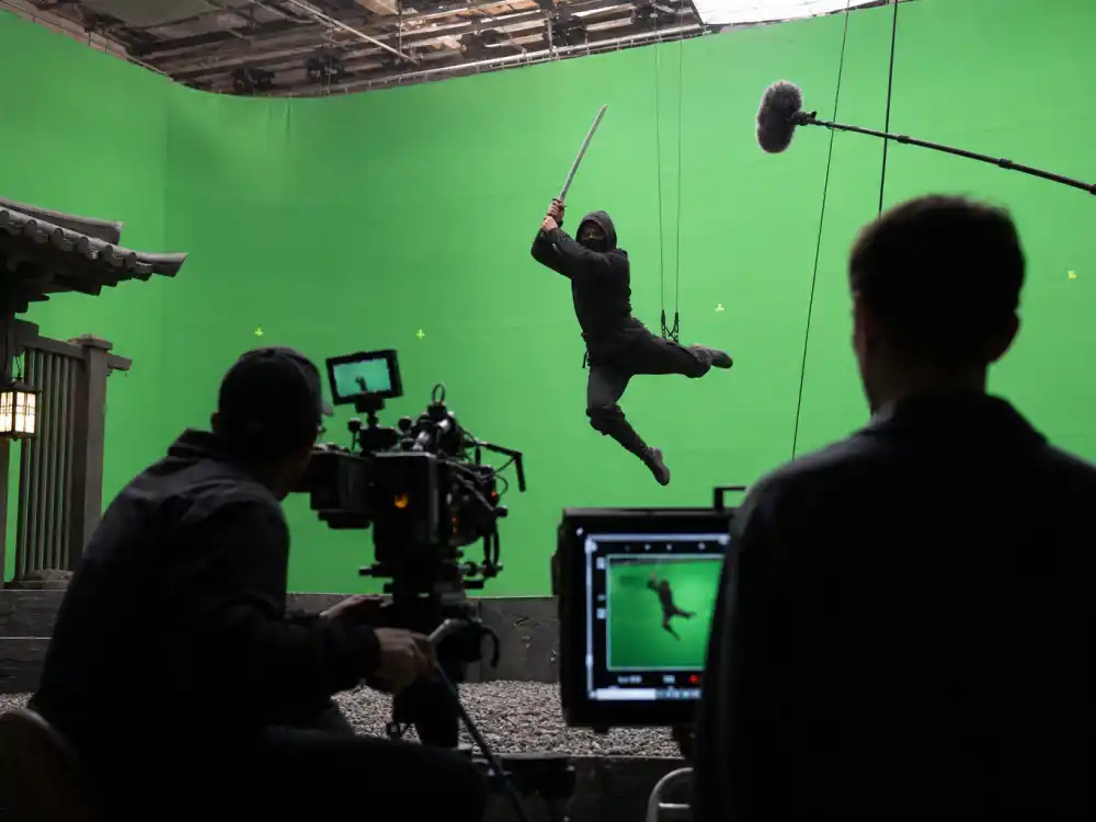 Action film production set reflecting how old is Keanu Reeves career arc from Toronto roots to global blockbuster stardom across The Matrix and John Wick franchises