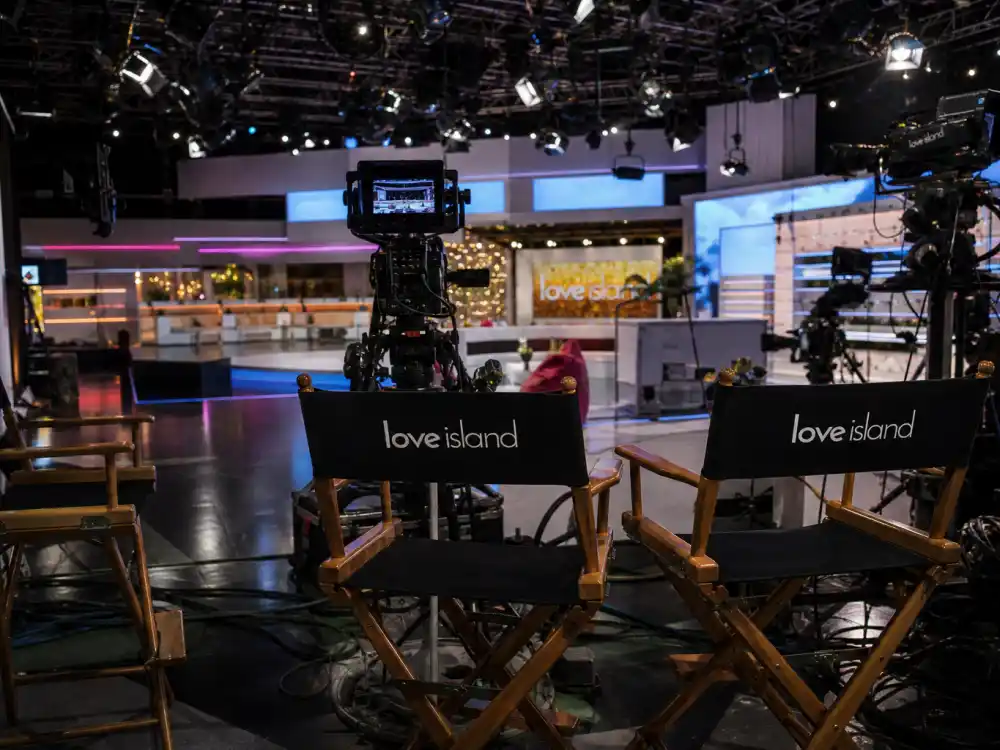 Television production set with cameras reflecting how old is Kendall Jenner at industry peak — reality television roots through global modeling dominance in her twenties