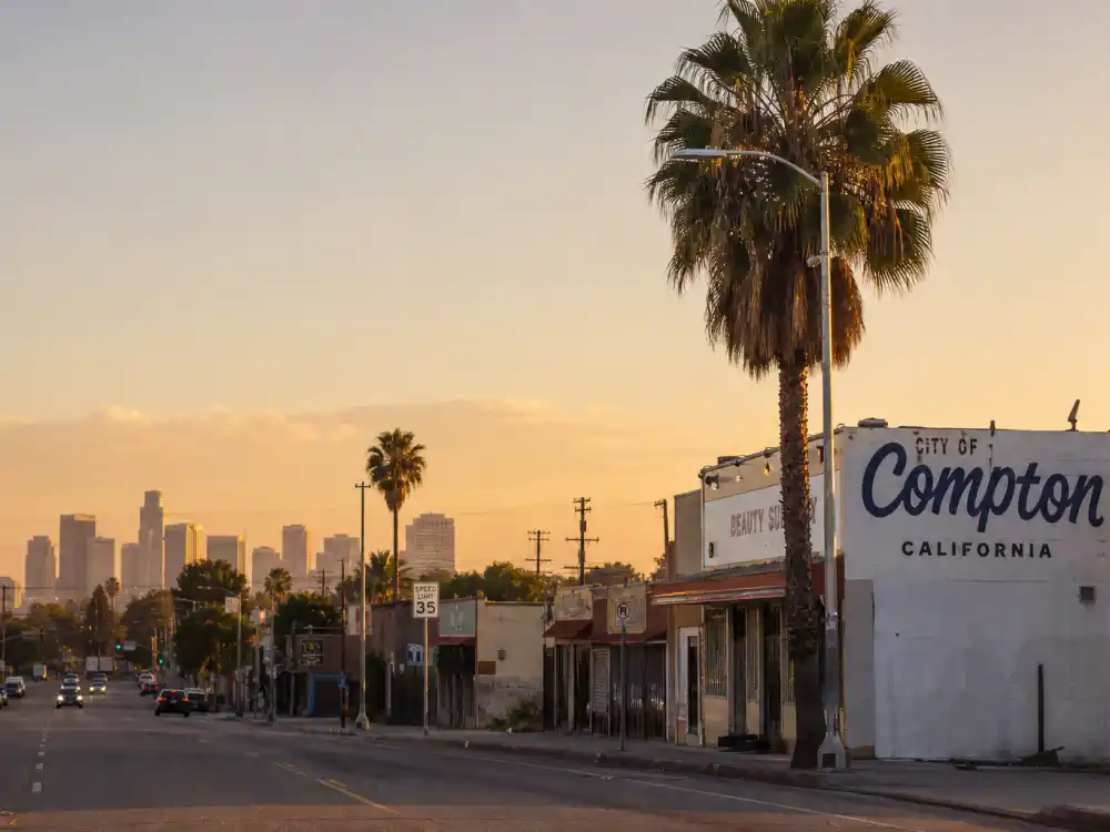 Compton California street scene evoking how old is Kendrick Lamar birthplace — the Southern California city where he was born on June 17, 1987