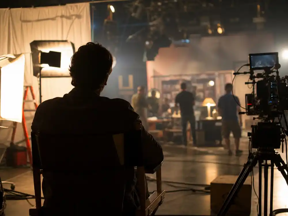 Film studio set reflecting how old is Kristen Stewart career arc from teen thriller breakout to global franchise dominance and acclaimed indie prestige work