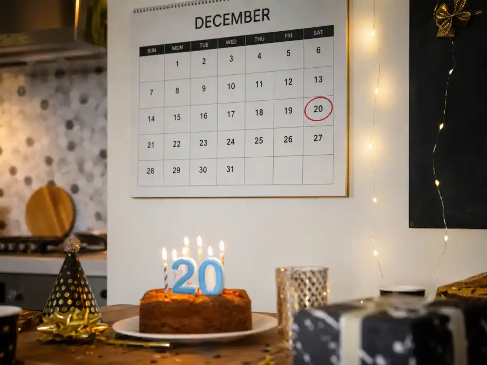 December 20 birthday calendar and candles marking how old is Kylian Mbappe each year when fans celebrate his Sagittarius birth date