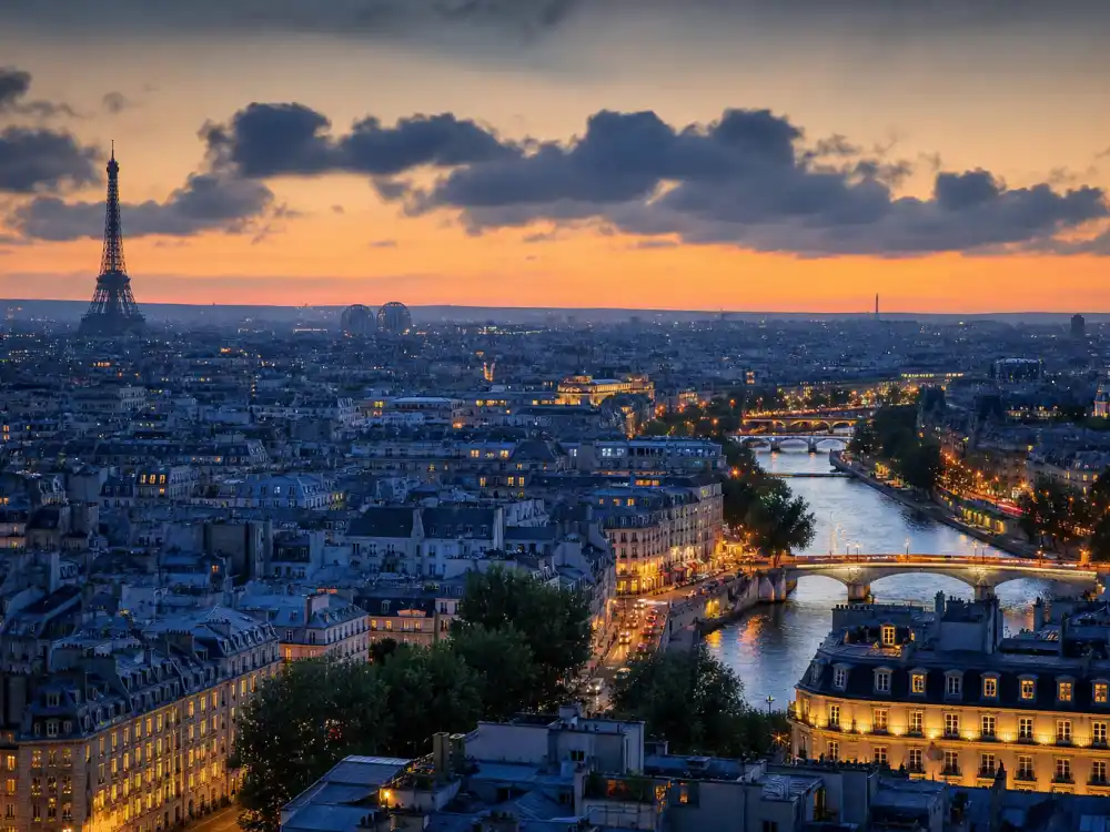 Paris France skyline evoking how old is Kylian Mbappe birthplace — the city where Kylian Mbappe Lottin was born on December 20, 1998
