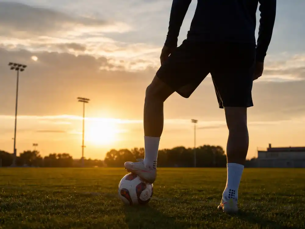 Soccer training field reflecting how old is Kylian Mbappe career arc from AS Monaco prodigy to Paris Saint-Germain star and Real Madrid signing