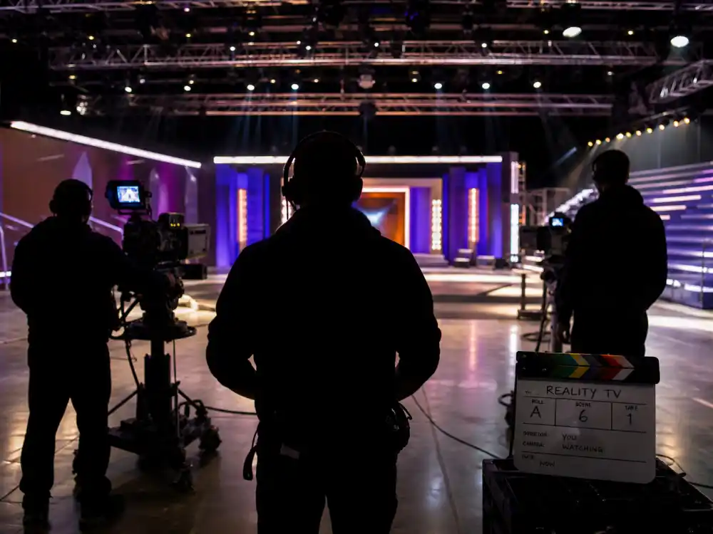 Television production set with cameras reflecting how old is Kylie Jenner at industry peak — reality television roots through beauty empire growth in her twenties