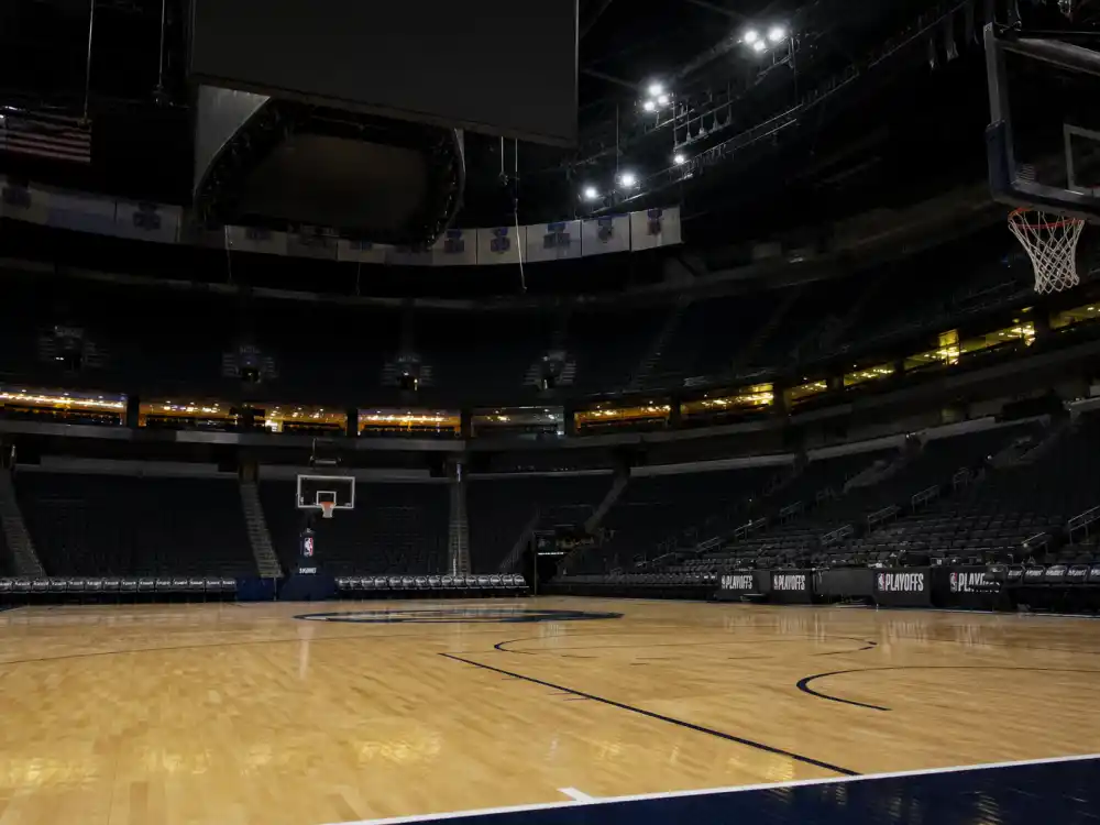 Professional NBA basketball arena court reflecting how old is LeBron James career arc from high school phenom to four-time champion and all-time scoring leader