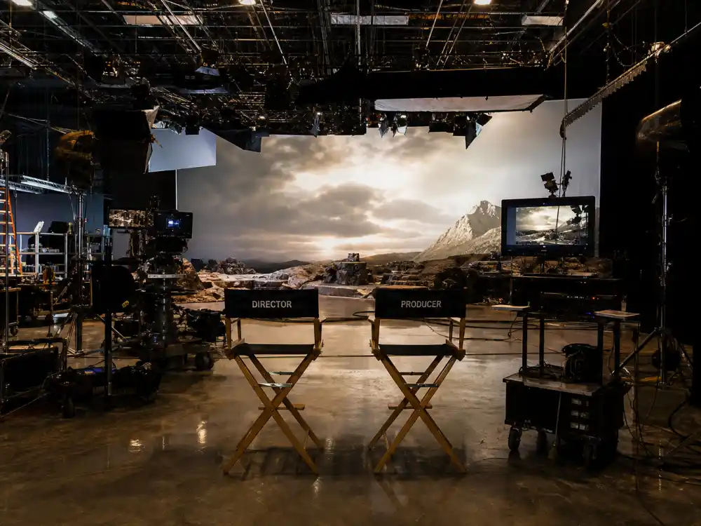 Film studio set reflecting how old is Margot Robbie career arc from Australian soap opera roots to Oscar-nominated blockbuster producing superstardom