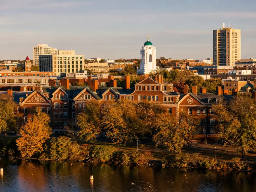 Cambridge Massachusetts skyline evoking how old is Matt Damon birthplace — the city where Matthew Paige Damon was born on October 8, 1970