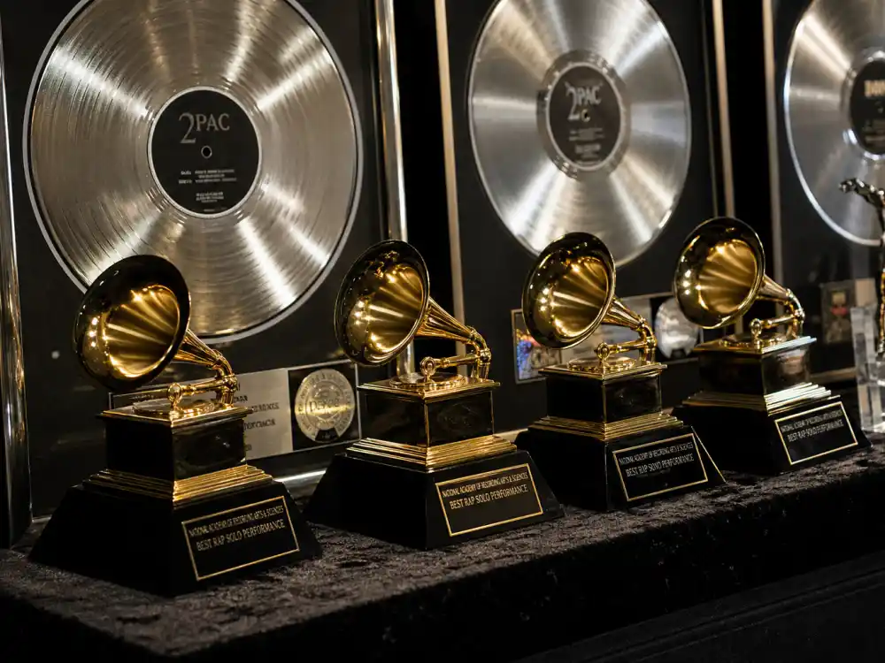 Music industry award trophy display reflecting how old is Nicki Minaj at industry peak — Grammy nominations and platinum album milestones across four decades of rap dominance