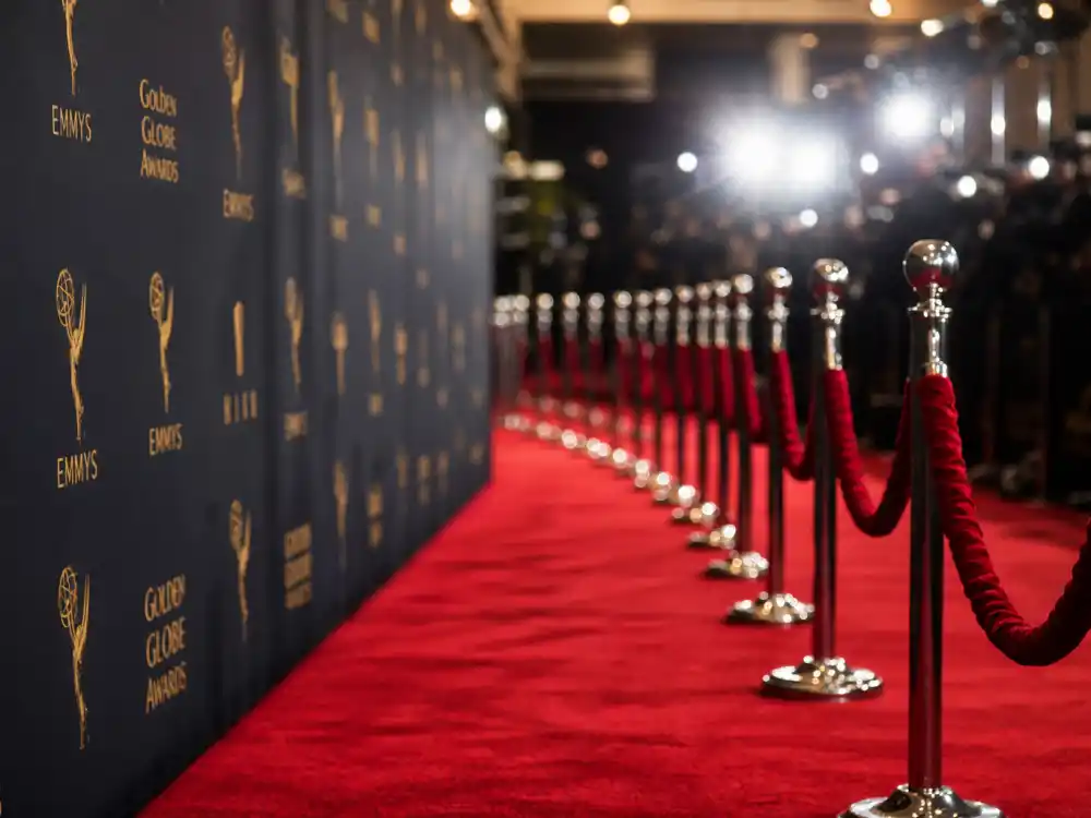 Red carpet premiere display reflecting how old is Oprah Winfrey at industry peak — Emmy milestones, Oscar nominations, and media empire dominance in her seventies