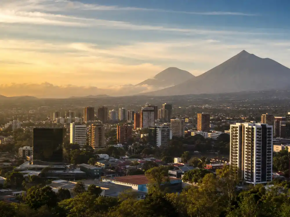 Guatemala City skyline evoking how old is Oscar Isaac birthplace — the city where Óscar Isaac Hernández Estrada was born on March 9, 1979