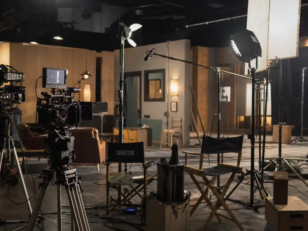 Film studio set reflecting how old is Robert Pattinson career arc from teen franchise breakout to indie reinvention and blockbuster superhero dominance