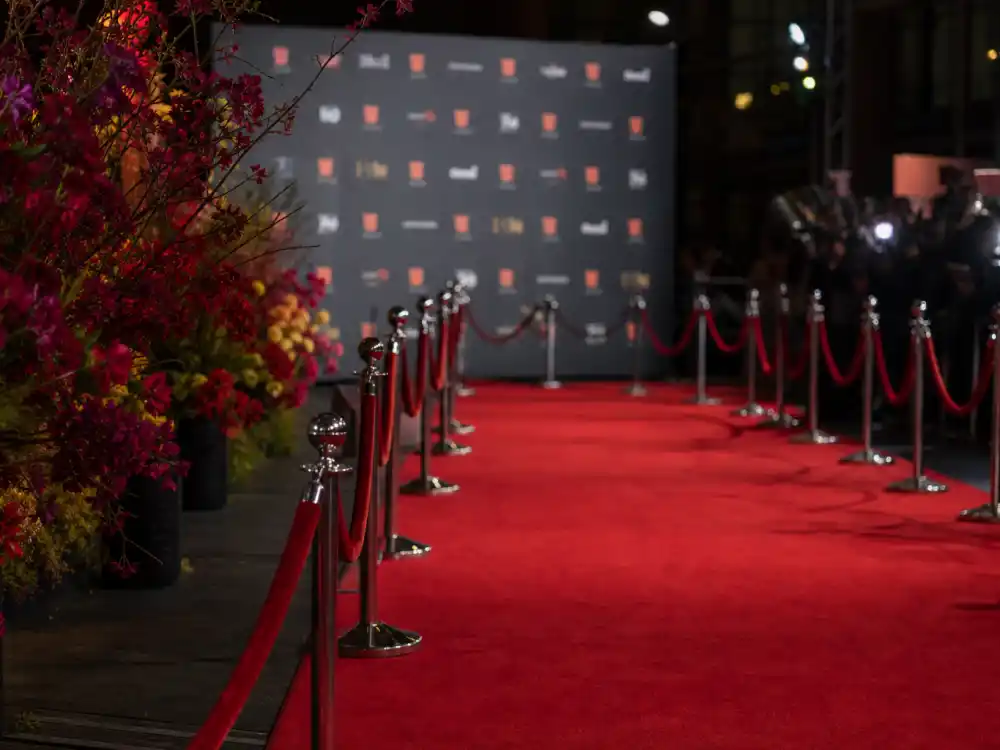 Red carpet premiere display reflecting how old is Rupert Grint at industry peak — franchise milestones and television breakthroughs across three decades