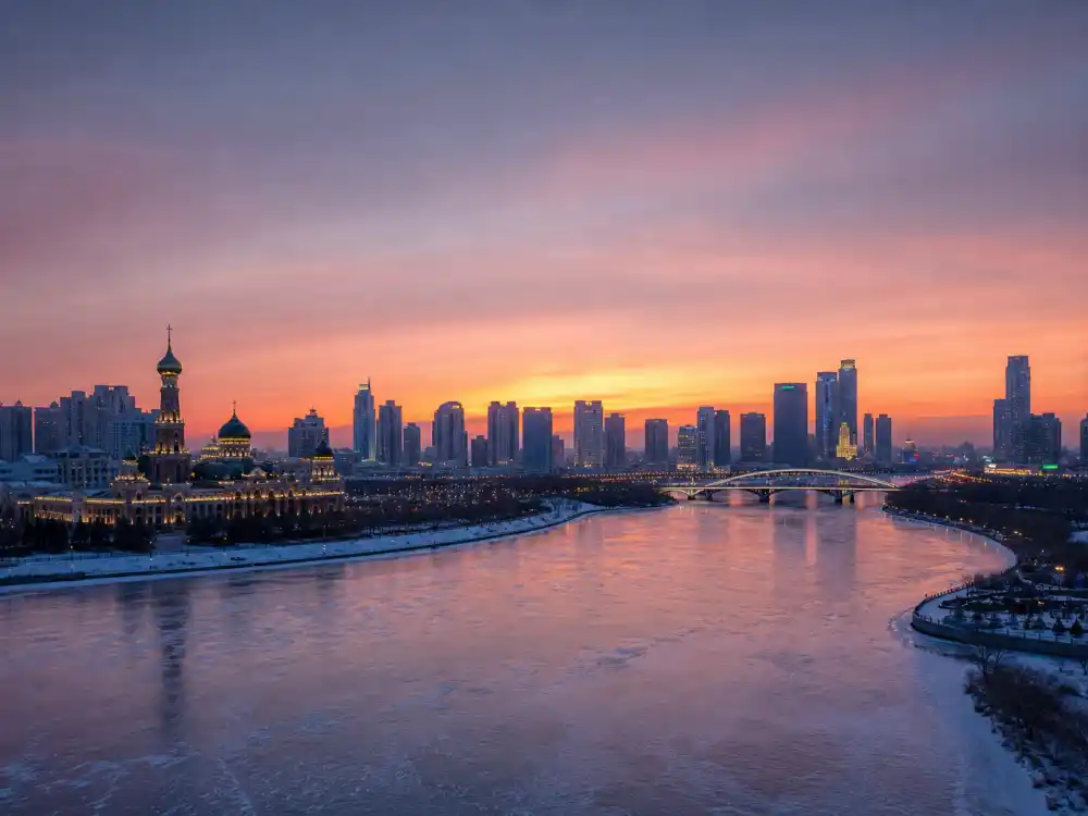 Harbin China skyline evoking how old is Simu Liu birthplace — the city where Simu Liu was born on April 19, 1989