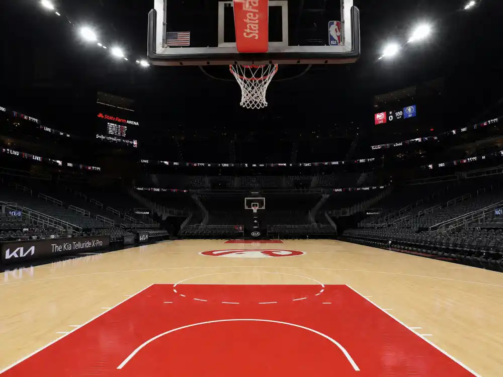 Professional basketball court reflecting how old is Stephen Curry career arc from Davidson College breakout to Golden State Warriors dynasty and four NBA titles