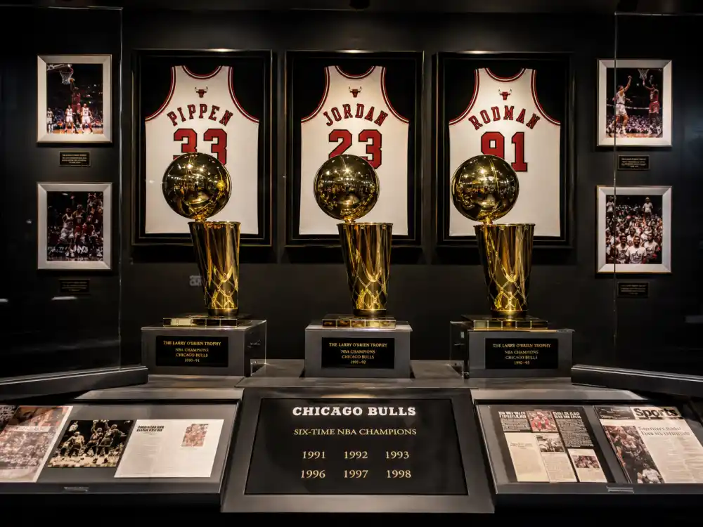 NBA championship trophy display reflecting how old is Stephen Curry at career peak — MVP awards, three-point records, and dynasty titles in his late thirties