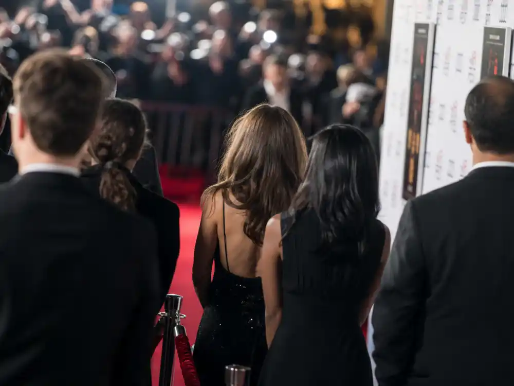 Red carpet premiere display reflecting how old is Tom Hanks at industry peak — Oscar-winning milestones and blockbuster franchise dominance in his sixties and seventies