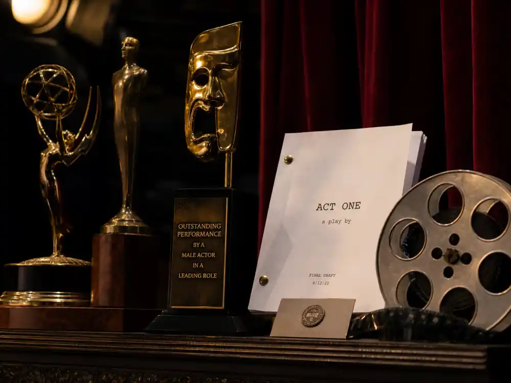 Theater and film award display reflecting how old is Tom Holland at industry peak — blockbuster franchise milestones and West End roots in his twenties