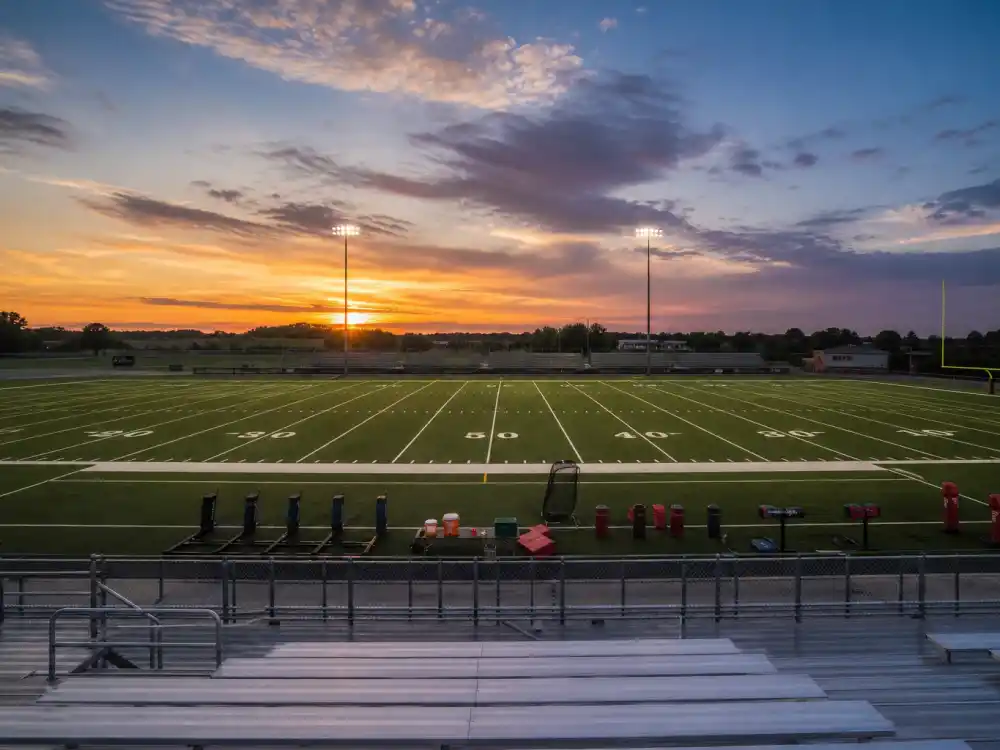 Football training field reflecting how old is Travis Kelce career arc from Ohio high school tight end to Kansas City Chiefs legend and Super Bowl champion