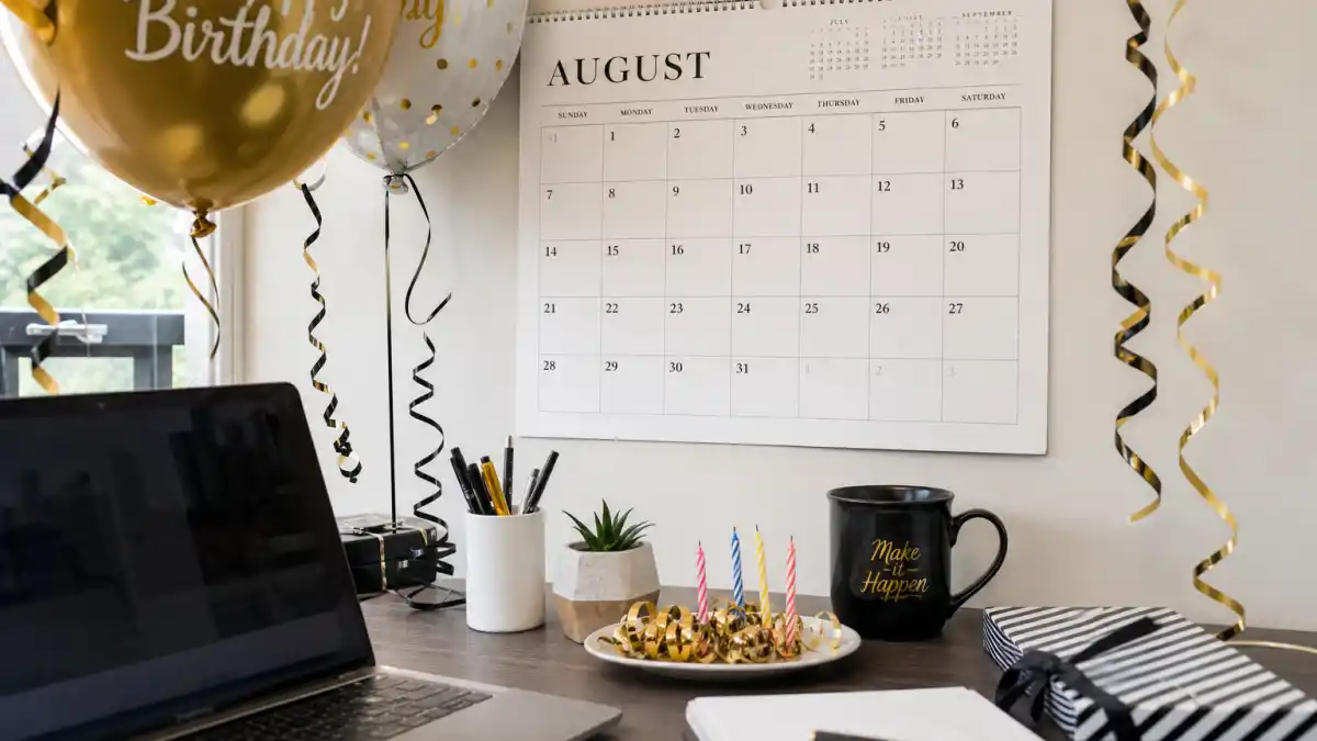 How old is Viola Davis — desk calendar open to August with birthday decorations marking her Leo birth date
