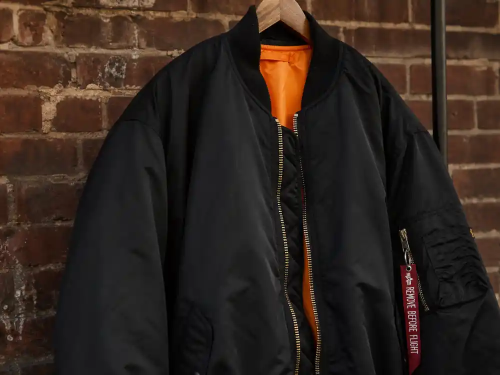Oversized black nylon bomber jacket central to how to dress like A$AP Rocky streetwear style outerwear rotation