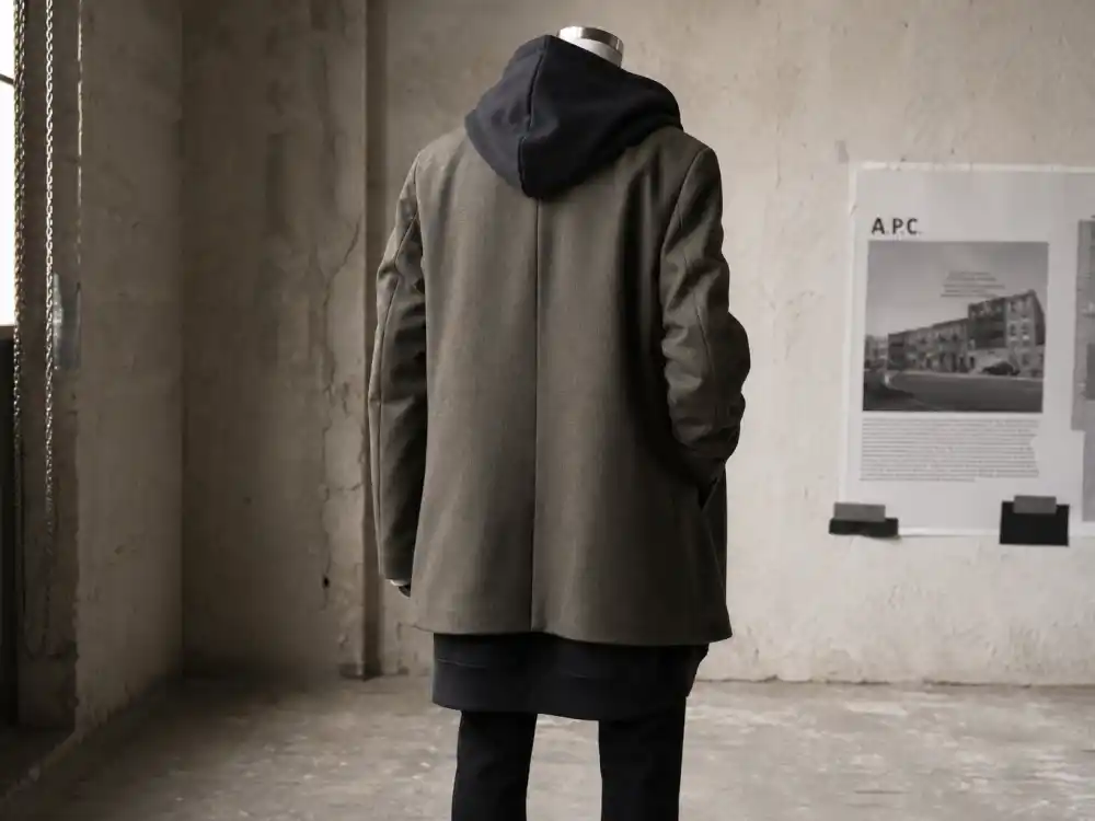 Oversized hoodie under long coat layering behind how to dress like A$AP Rocky streetwear style proportion codes